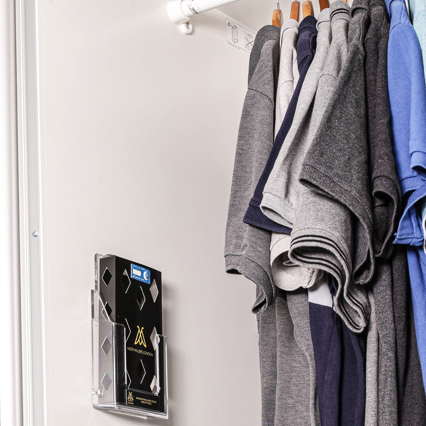 moth trap ltd moth pheromone box in holder stuck on inside of wardrobe